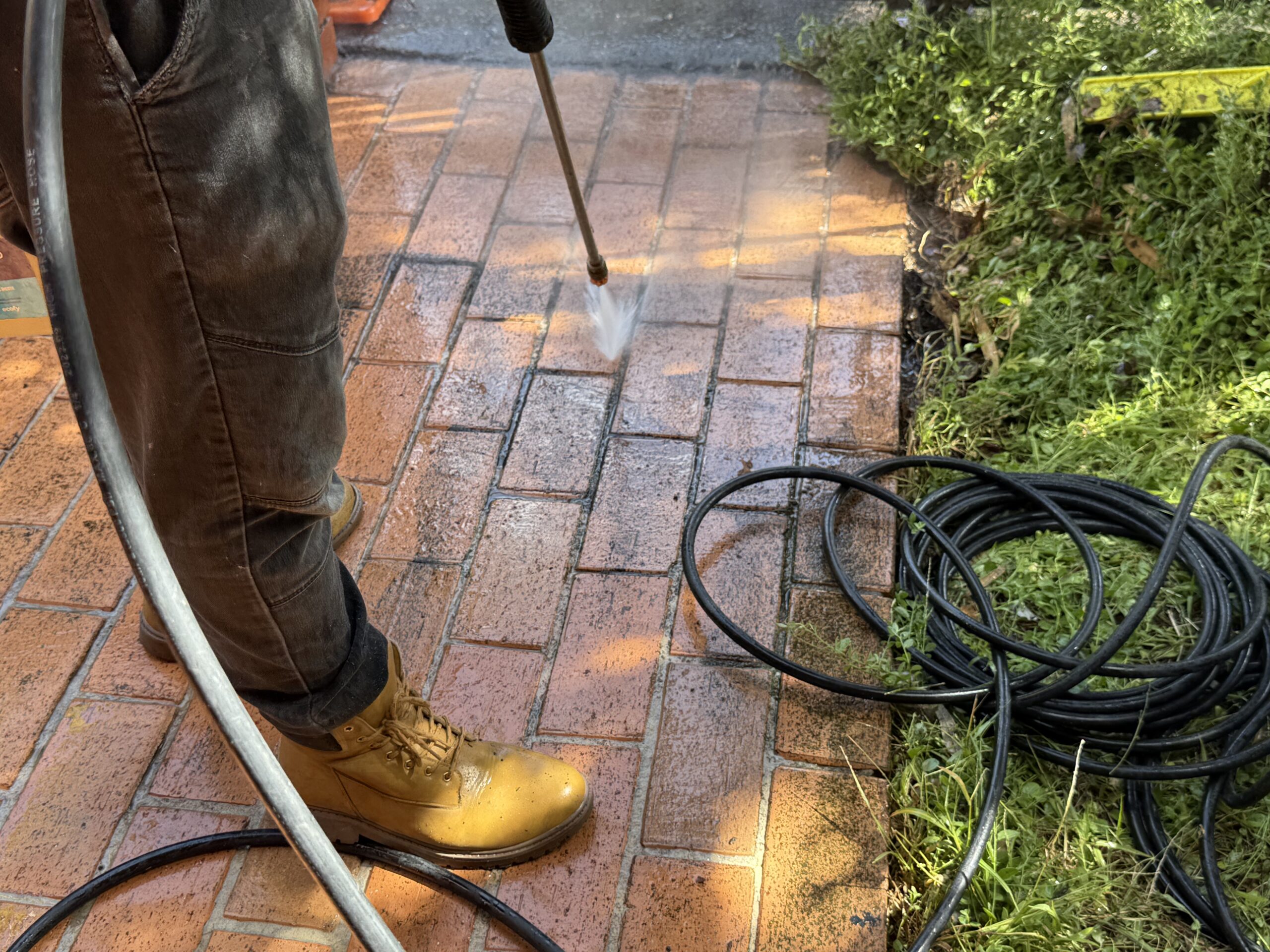 A Man doing pressure cleaning.