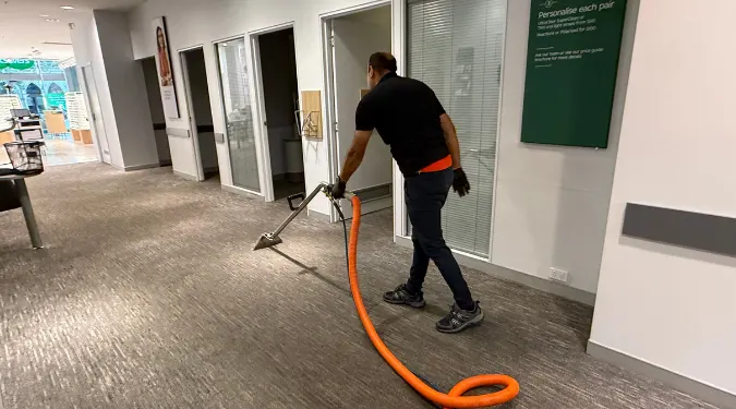 Man cleaning carpet